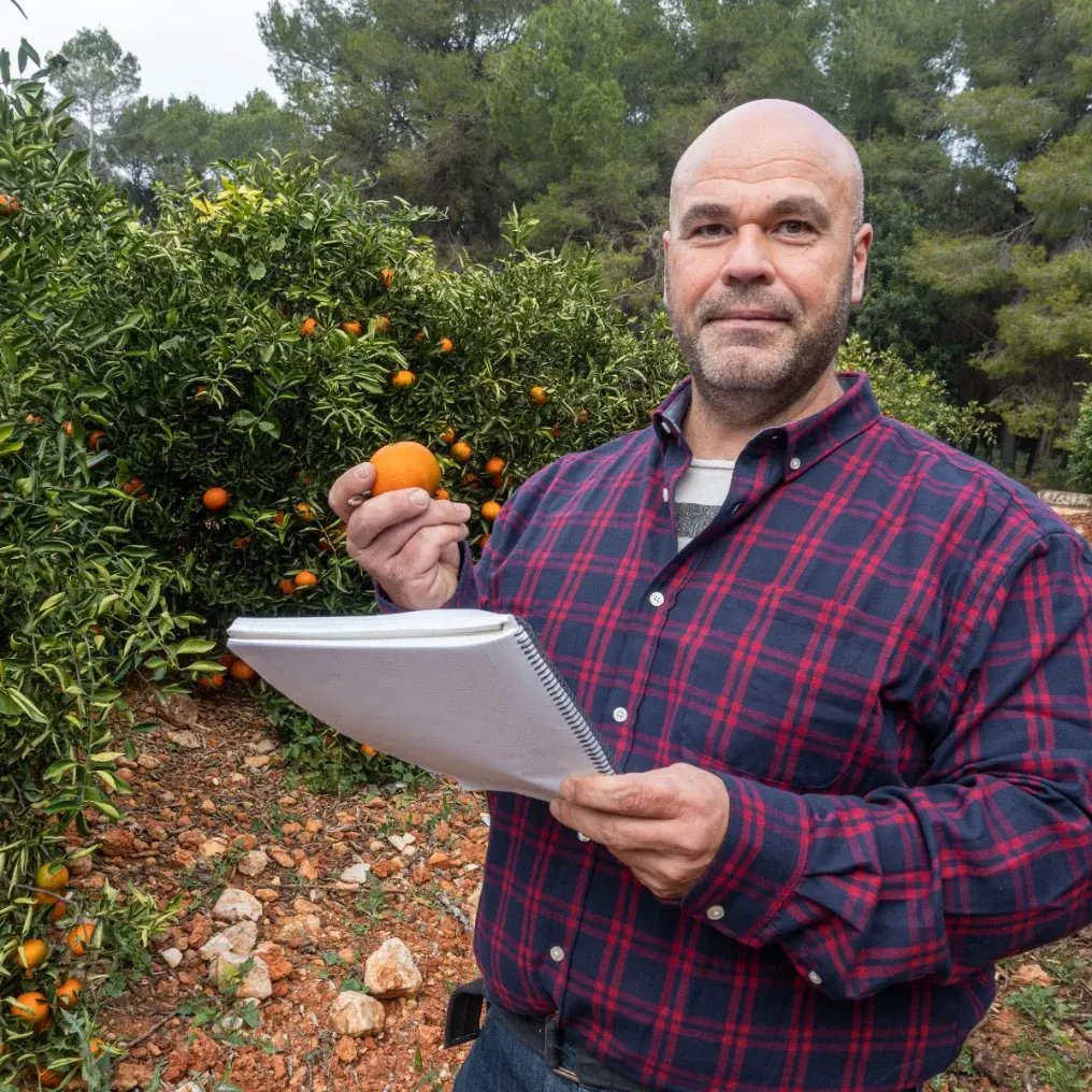 Cooperative technician talking with a grower