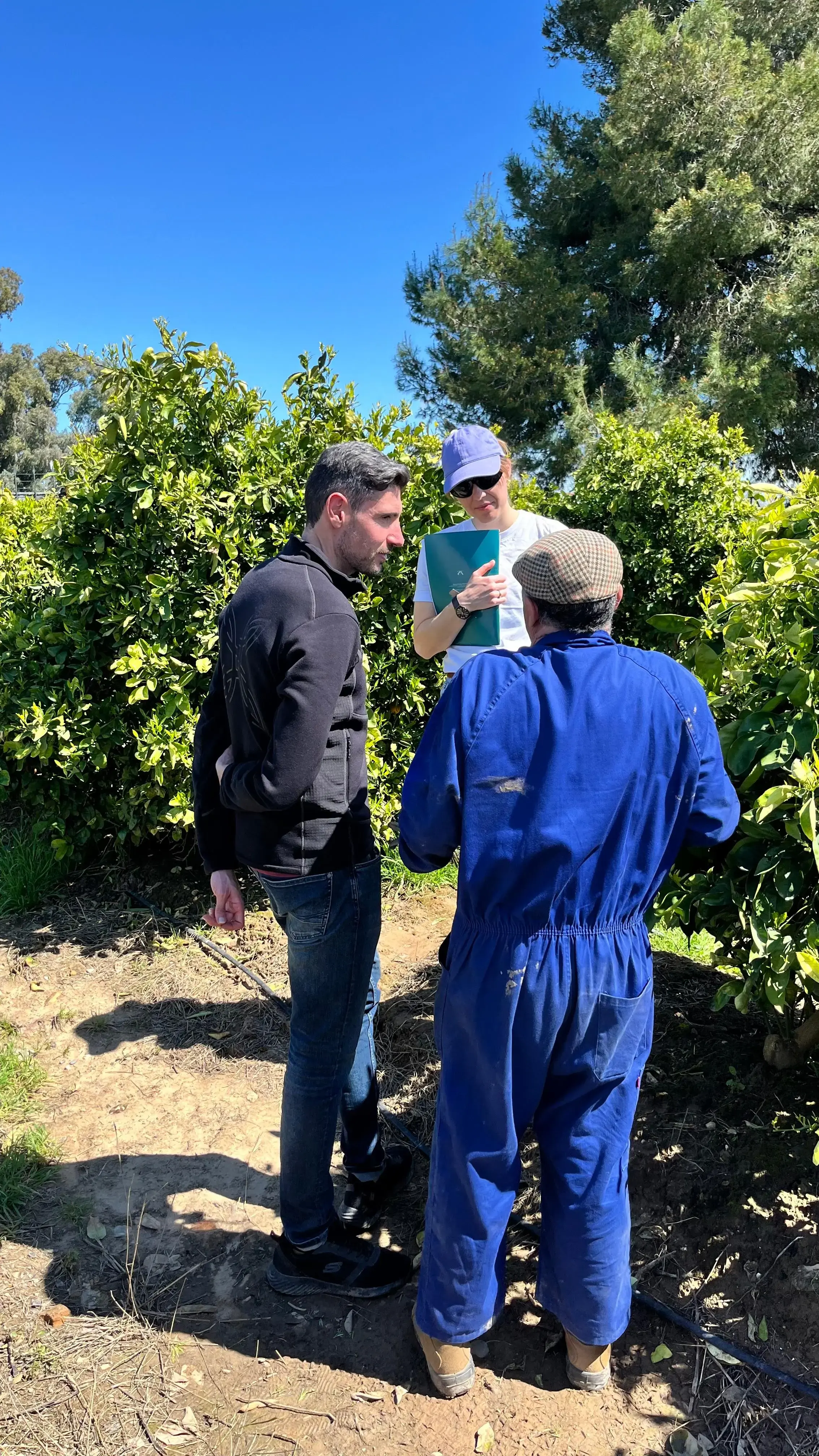 Greenda team listening to farmer