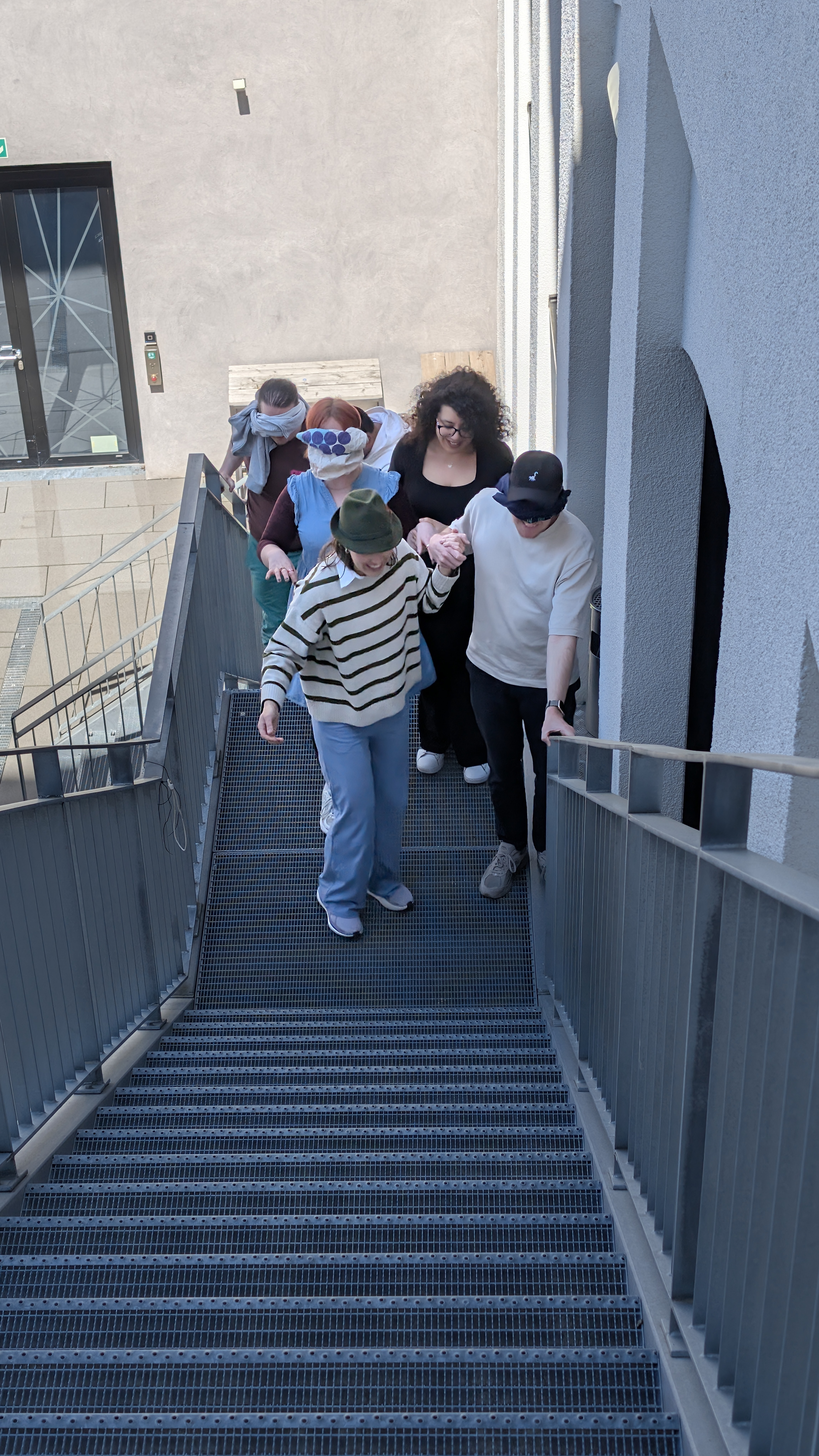 Blindfolded on the stairs